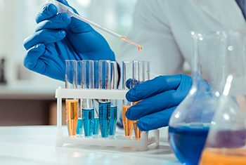 Close up of test tubes being used in chemical lab Chemical samples. Close up of test tubes being used by a smart skilled scientist in the chemical lab